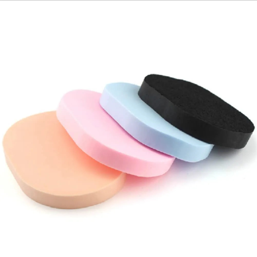 Reusable Facial Cleansing Sponges – 4 Pack in various colors: peach, pink, blue, and black sponges for gentle facial care.