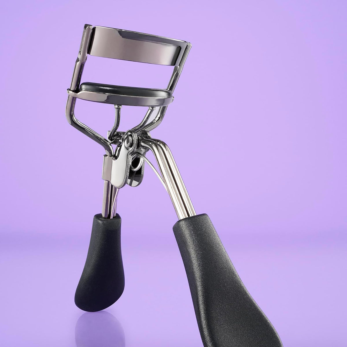 Pro Eyelash Curler with ergonomic handle and stainless steel frame for perfectly shaped lashes.