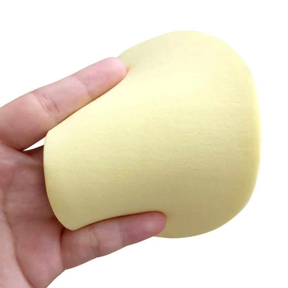 Reusable Facial Cleansing Sponges – 4 Pack shown in hand, soft sponge for daily cleansing and makeup removal.